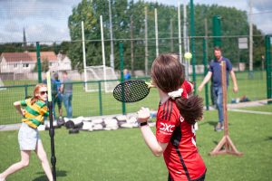 A group children are playing a a tennis game as part of a family fun day outdoor event in Cork