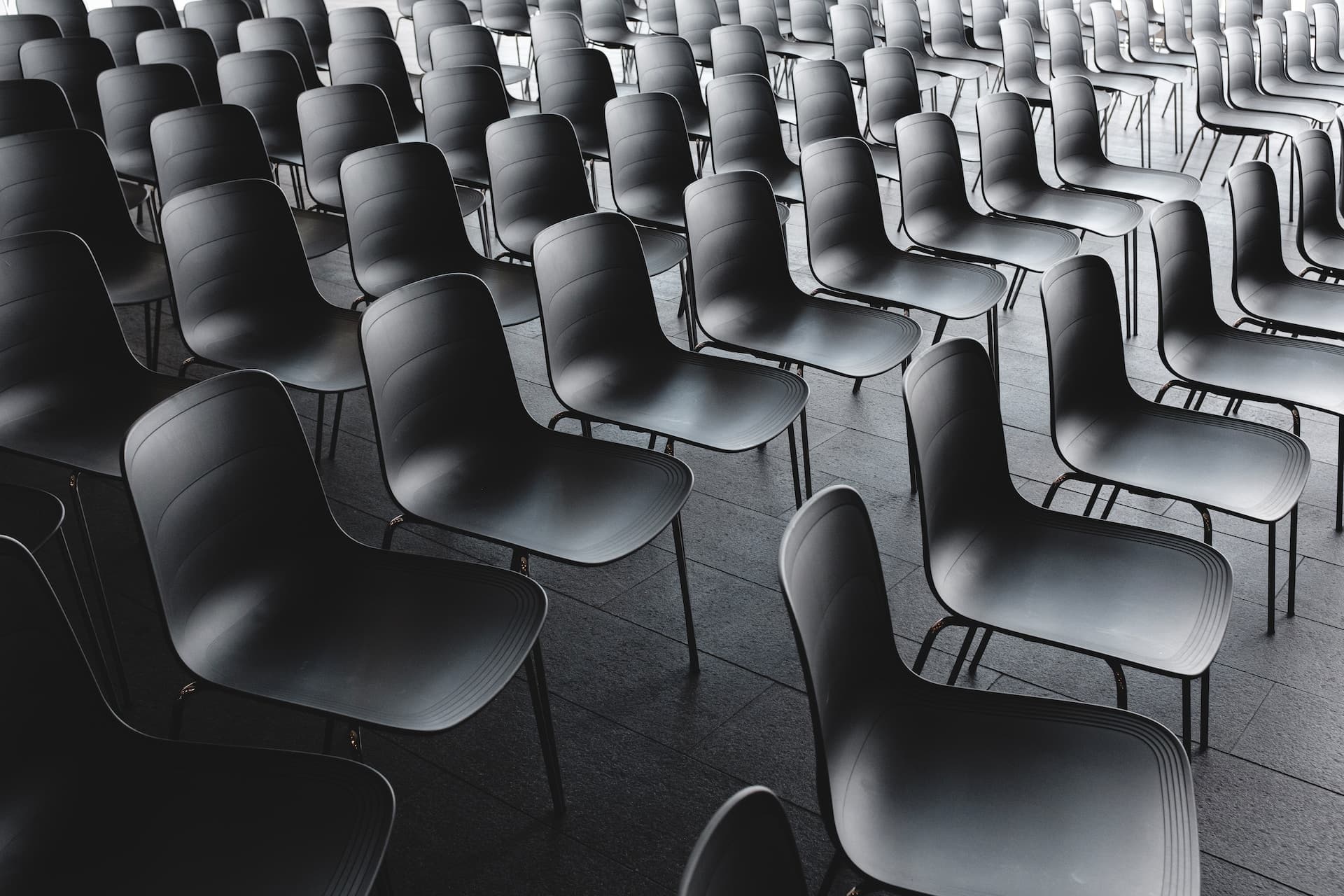 empty seats ready for attendees at a company conference