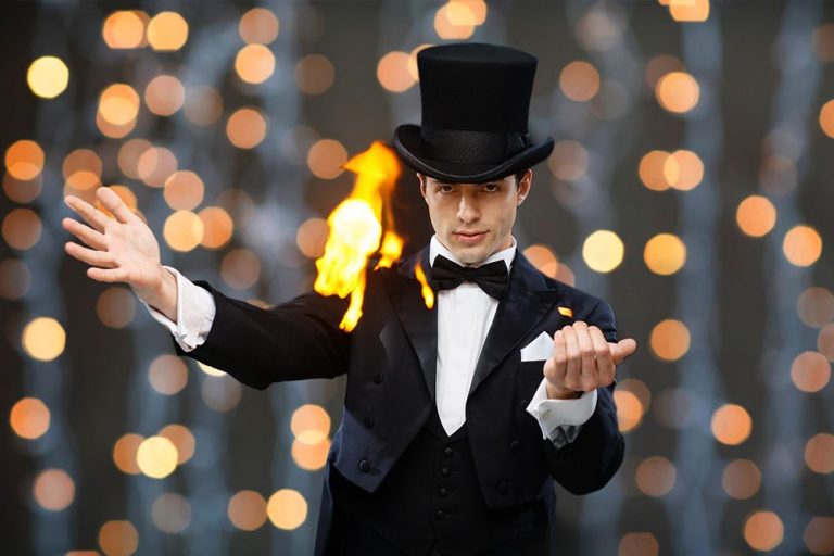 a magician performing for a crowd at a family event